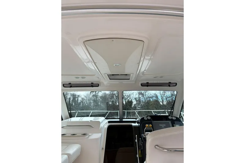  Yacht Photos Pics Interior view of 2008 Tiara Yachts 3000 Open, showcasing helm and seating area.