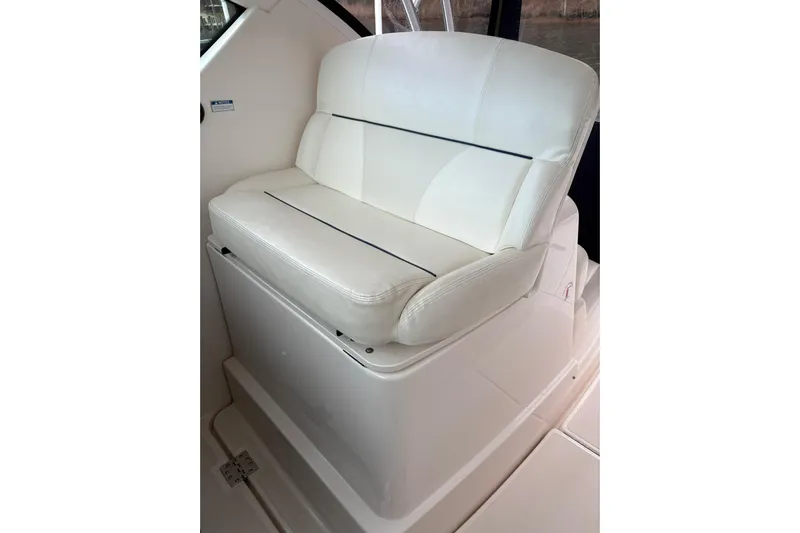  Yacht Photos Pics White cushioned seat on 2008 Tiara Yachts 3000 Open boat interior.