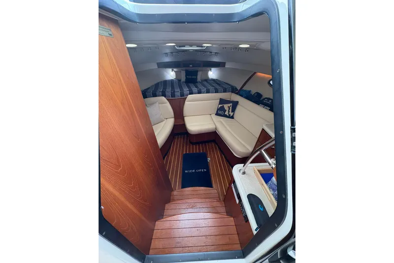  Yacht Photos Pics Interior of 2008 Tiara Yachts 3000 Open, featuring cozy seating and wooden flooring.