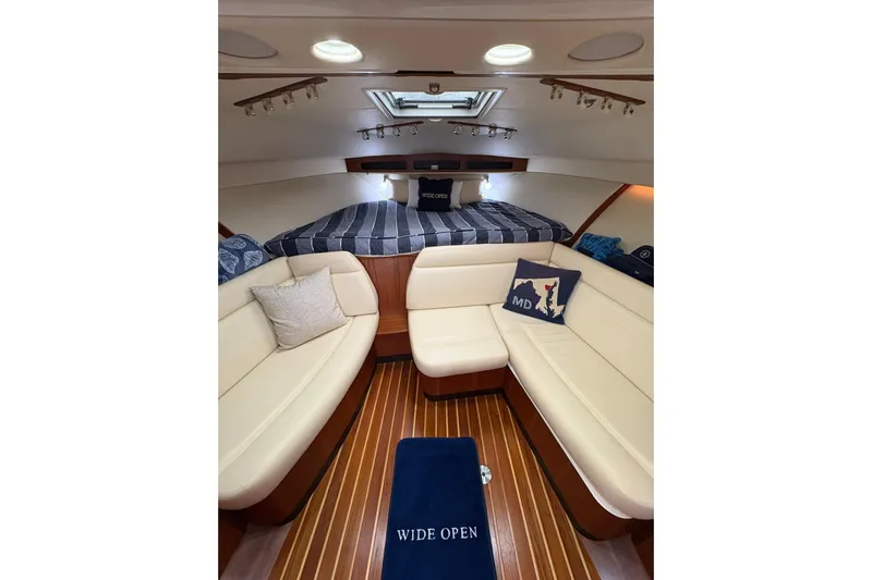  Yacht Photos Pics Interior of 2008 Tiara Yachts 3000 Open, featuring cozy seating and elegant wood flooring.