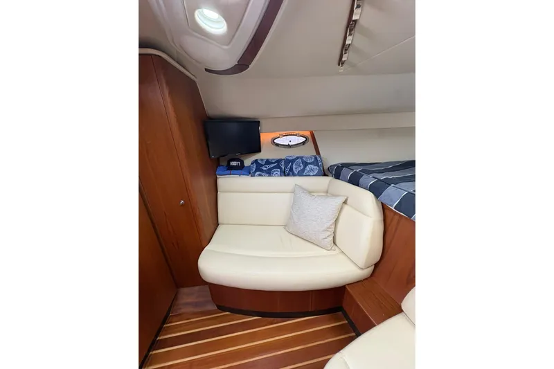  Yacht Photos Pics 2008 Tiara Yachts 3000 Open cabin interior with seating and wood accents.