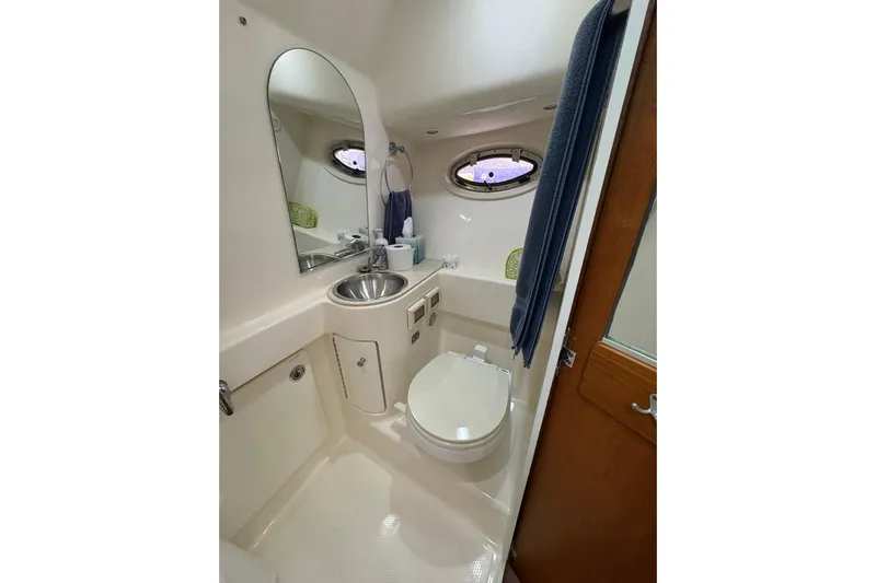  Yacht Photos Pics 2008 Tiara Yachts 3000 Open bathroom with sink, toilet, and mirror.