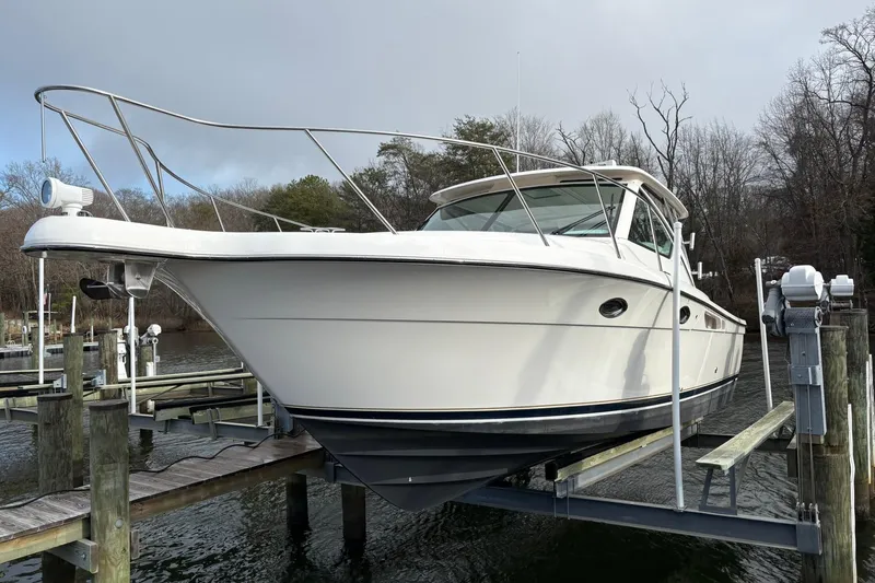  Yacht Photos Pics 2008 Tiara Yachts 3000 Open on lift at marina dock.