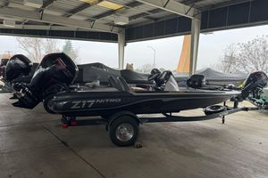 2026 Nitro Z17 boat in a covered storage area, featuring powerful outboard motors.