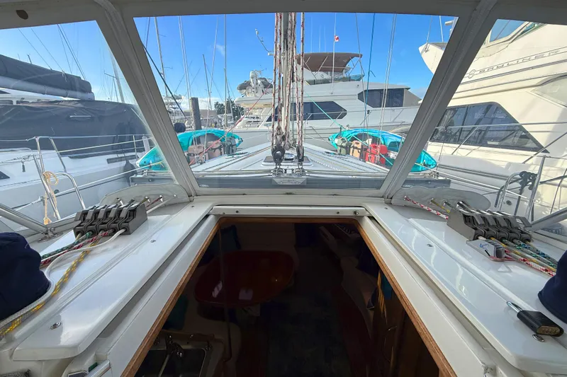 Shumka Yacht Photos Pics 2005 Catalina 42 MkII sailboat cockpit view with marina background.