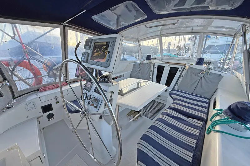 Shumka Yacht Photos Pics Cockpit of 2005 Catalina 42 MkII sailboat with navigation equipment and seating.