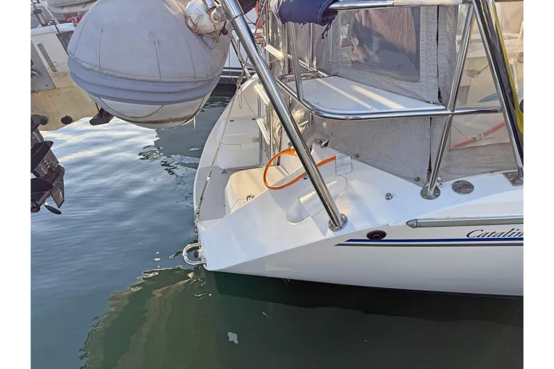 Shumka Yacht Photos Pics Catalina 42 MkII 2005 sailboat docked, featuring a clean white deck and safety railings.