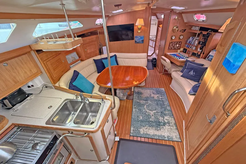 Shumka Yacht Photos Pics Interior of 2005 Catalina 42 MkII sailboat with cozy seating and modern kitchen.