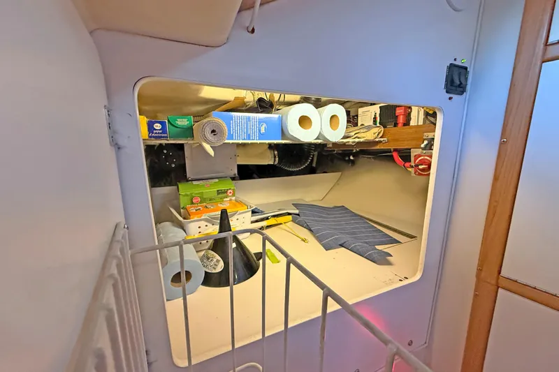 Shumka Yacht Photos Pics Storage compartment in a 2005 Catalina 42 MkII sailboat with various supplies.