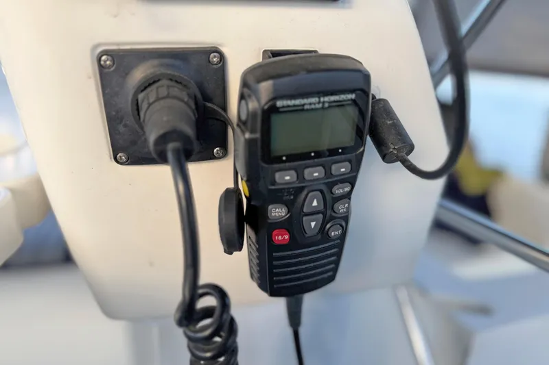 Shumka Yacht Photos Pics VHF radio on 2005 Catalina 42 MkII sailboat, mounted on a white panel.