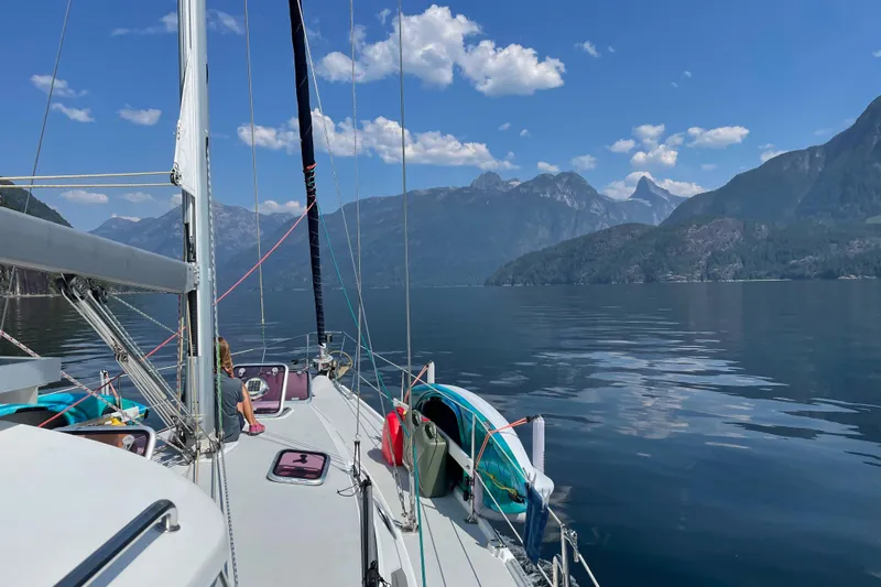 Shumka Yacht Photos Pics Sailing on a 2005 Catalina 42 MkII with scenic mountain views and calm waters.