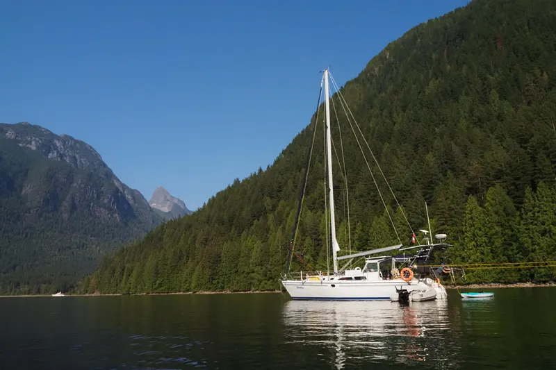 Shumka Yacht Photos Pics Catalina 42 MkII sailboat anchored in scenic mountain lake, 2005 model.