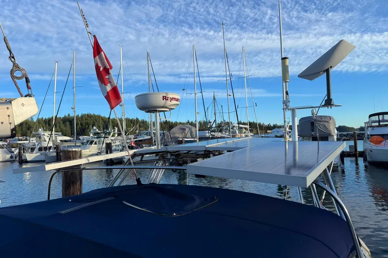 Shumka Yacht Photos Pics Catalina 42 MkII sailboat, 2005 model, docked with solar panels and Canadian flag.