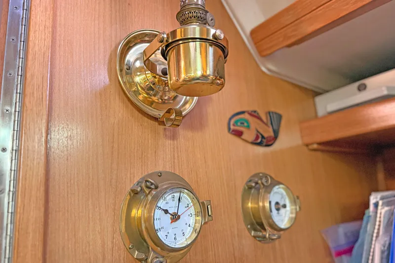 Shumka Yacht Photos Pics Brass fixtures and clock on Catalina 42 MkII yacht interior, 2005 model.