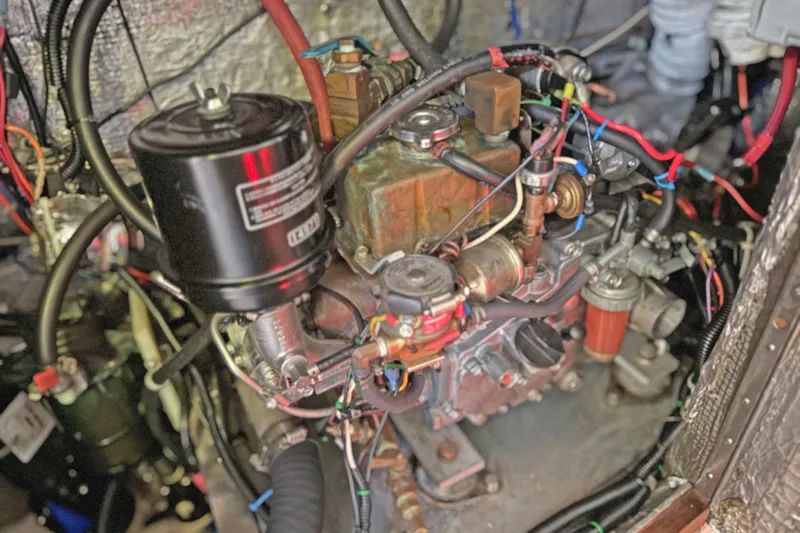 Shumka Yacht Photos Pics Engine compartment of a 2005 Catalina 42 MkII sailboat, showcasing wiring and components.