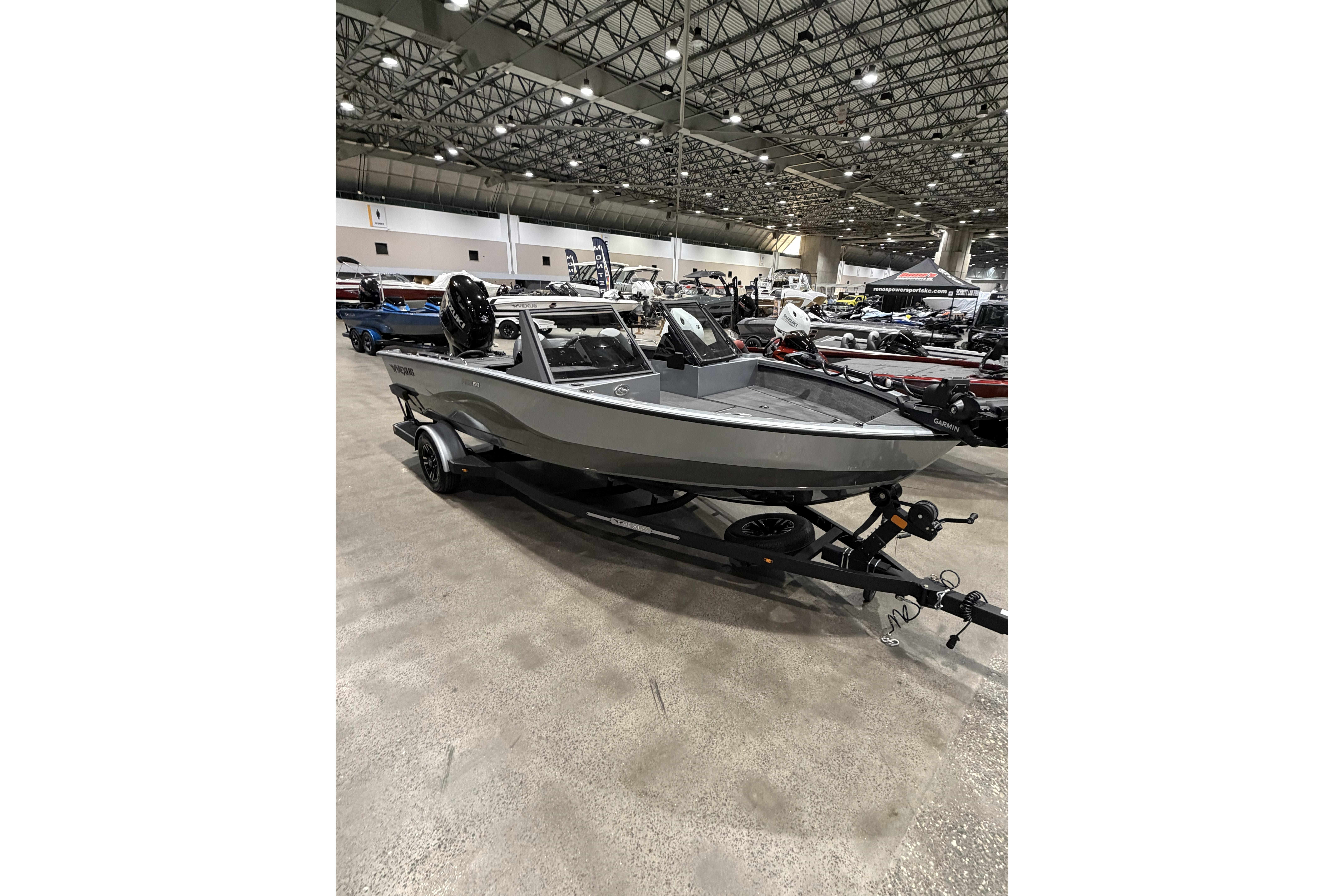 2026 Vexus ADX 190 boat displayed indoors on a trailer.