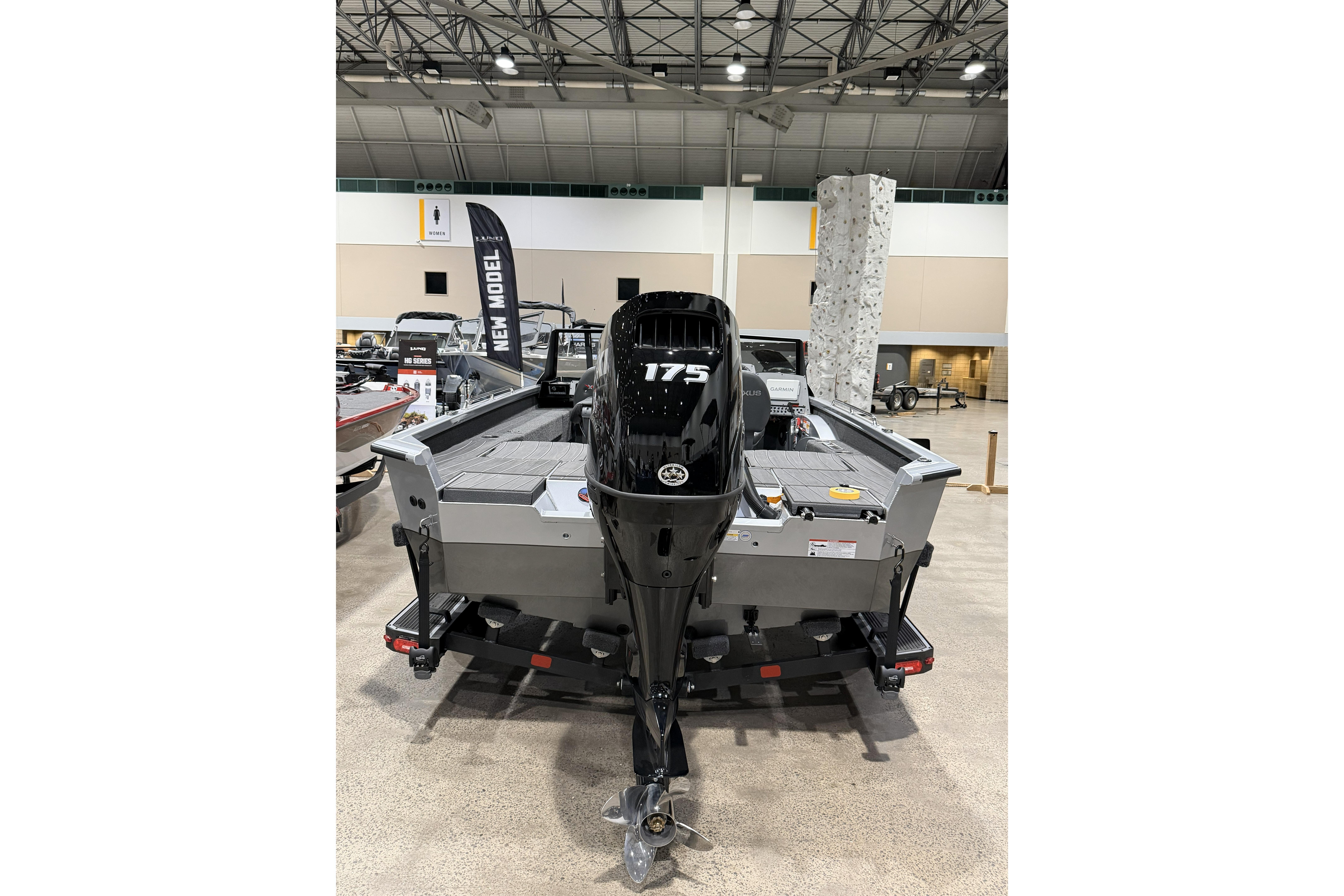 2026 Vexus ADX 190 boat with 175 horsepower engine displayed indoors.