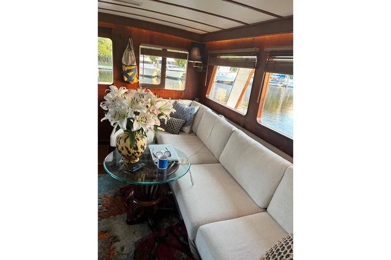 Savasa Yacht Photos Pics Luxurious 1979 Cheoy Lee 46 LRC yacht interior with elegant decor and large windows.