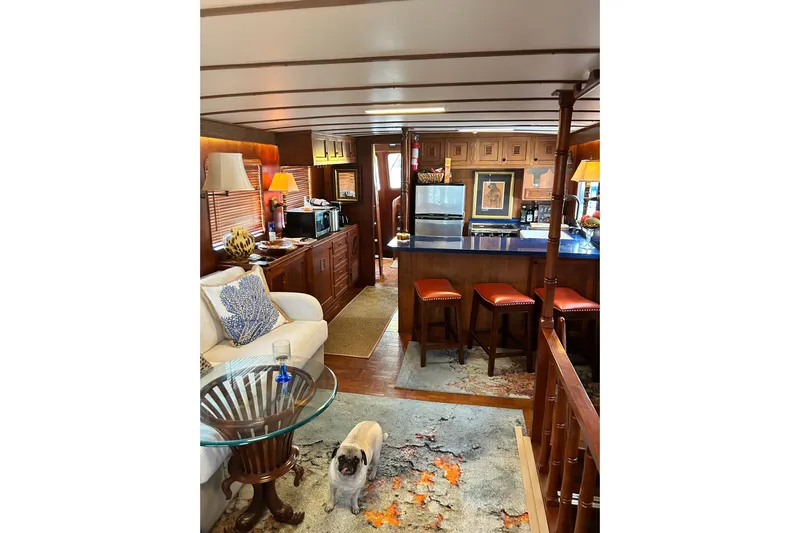 Savasa Yacht Photos Pics Interior of 1979 Cheoy Lee 46 LRC yacht with cozy seating and kitchen area.