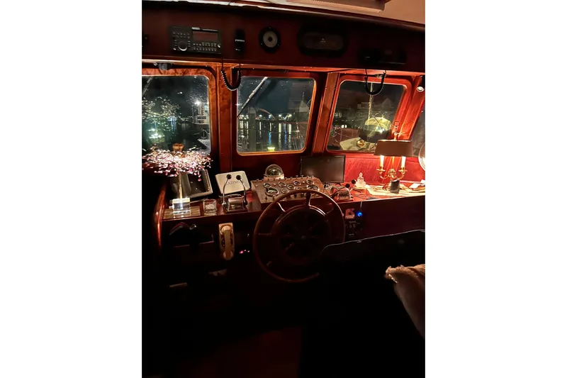 Savasa Yacht Photos Pics 1979 Cheoy Lee 46 LRC yacht interior with vintage helm and nautical decor.