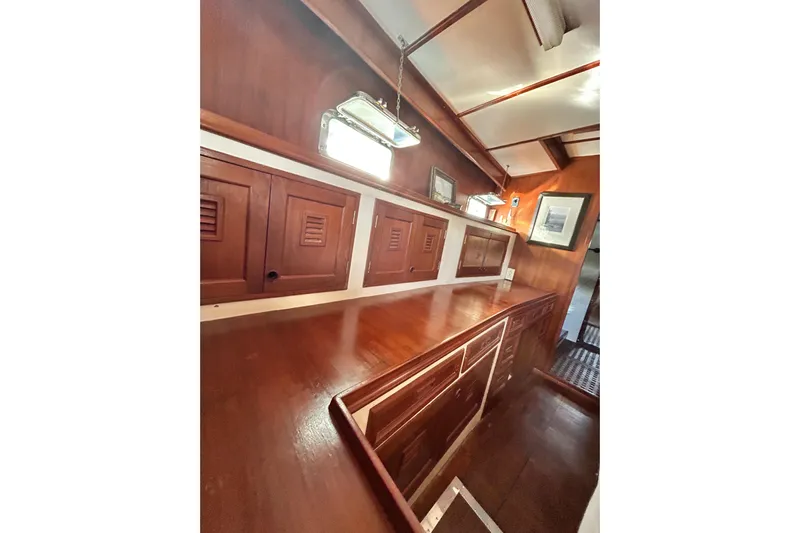 Savasa Yacht Photos Pics Interior of 1979 Cheoy Lee 46 LRC yacht with wooden cabinetry and ambient lighting.