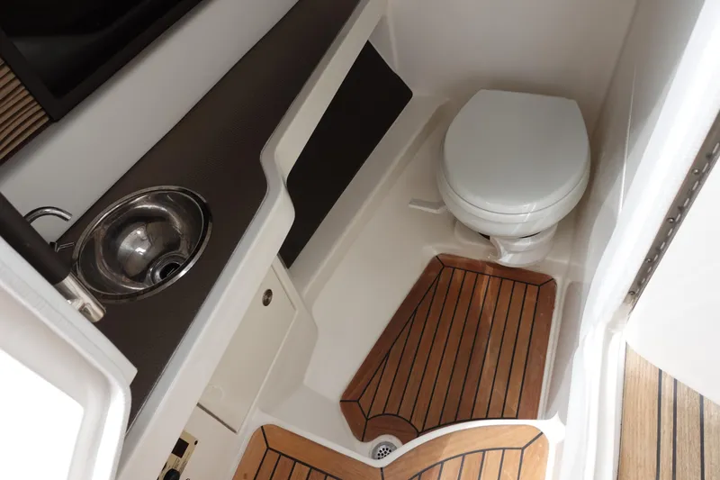  Yacht Photos Pics 2017 Sea Ray SLX 310 boat bathroom with sink and wooden flooring.