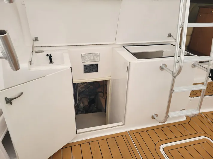  Yacht Photos Pics 1986 Ocean Yachts 55 Super Sport engine room access with teak deck.