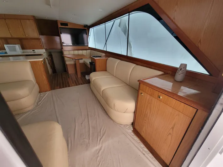  Yacht Photos Pics Interior of 1986 Ocean Yachts 55 Super Sport with beige leather seating and wooden cabinetry.