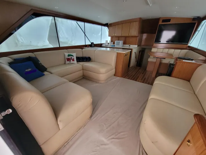  Yacht Photos Pics Luxurious interior of 1986 Ocean Yachts 55 Super Sport with beige leather seating and modern amenities.