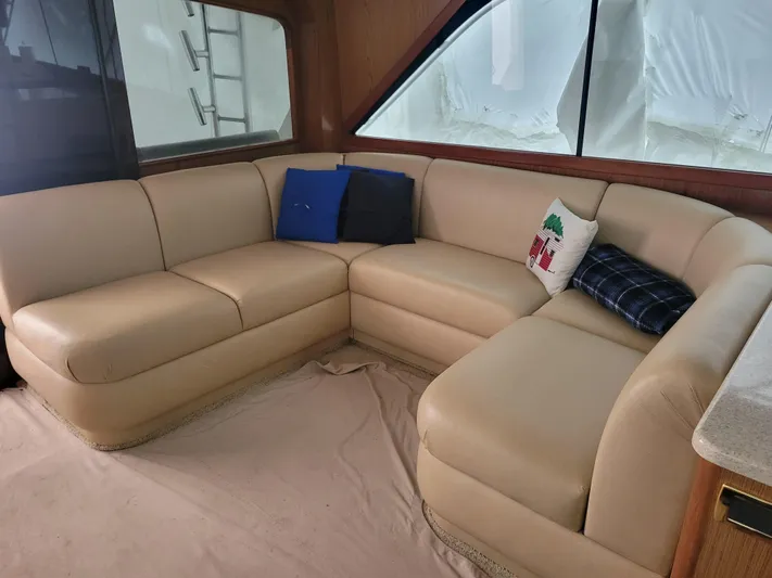  Yacht Photos Pics Interior of 1986 Ocean Yachts 55 Super Sport with beige leather seating and decorative pillows.