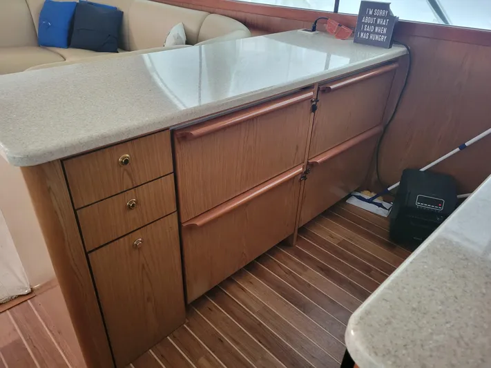  Yacht Photos Pics 1986 Ocean Yachts 55 Super Sport yacht interior with wooden cabinetry and countertop.