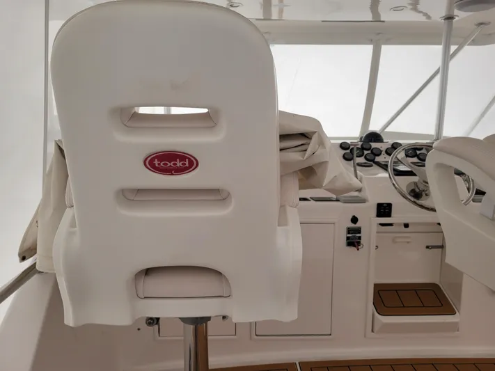  Yacht Photos Pics Captain's chair and helm of a 1986 Ocean Yachts 55 Super Sport.