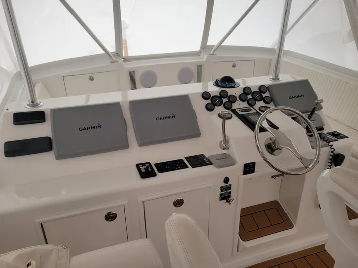  Yacht Photos Pics Helm station of 1986 Ocean Yachts 55 Super Sport with Garmin navigation systems.