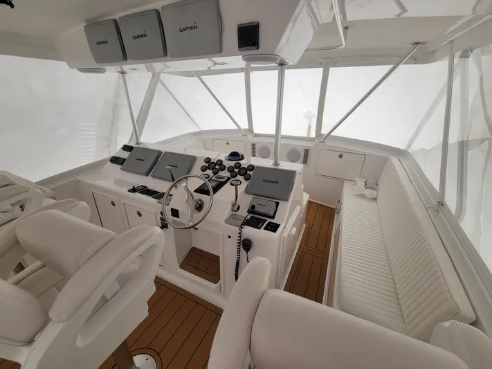  Yacht Photos Pics Cockpit of a 1986 Ocean Yachts 55 Super Sport with modern navigation equipment.