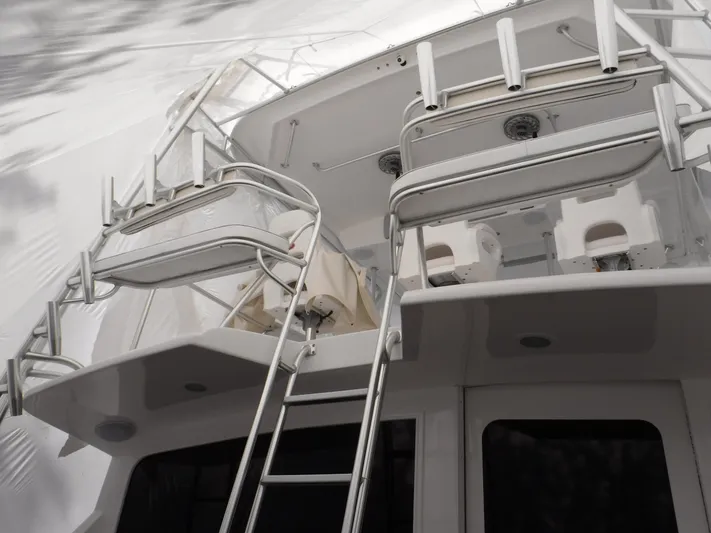  Yacht Photos Pics 1986 Ocean Yachts 55 Super Sport boat with ladder and upper deck.