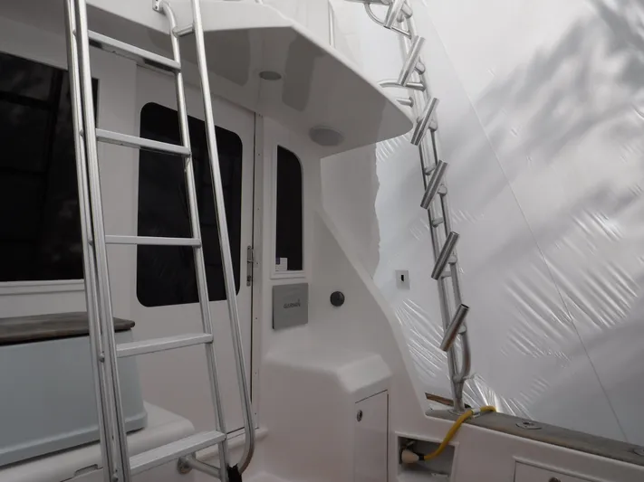  Yacht Photos Pics 1986 Ocean Yachts 55 Super Sport yacht with ladder and deck view.