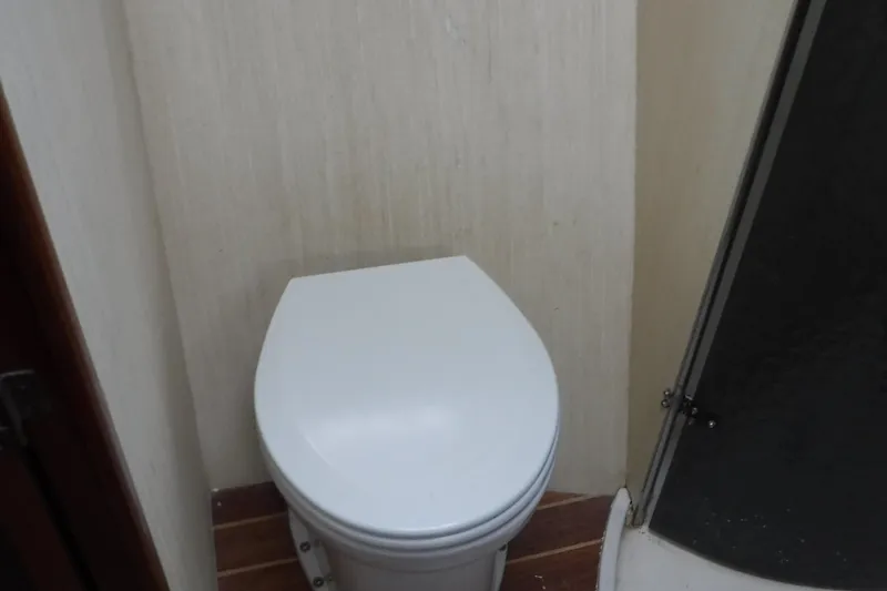  Yacht Photos Pics 1986 Ocean Yachts 55 Super Sport bathroom with toilet and shower.