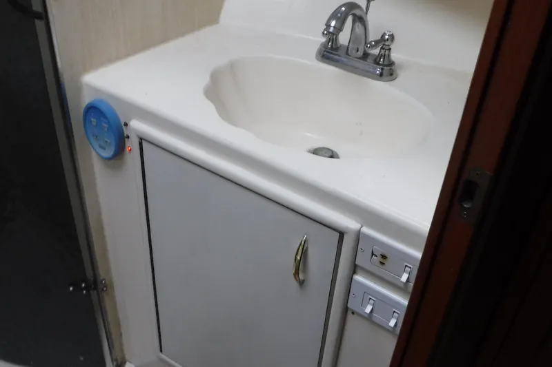  Yacht Photos Pics 1986 Ocean Yachts 55 Super Sport bathroom sink and cabinet.