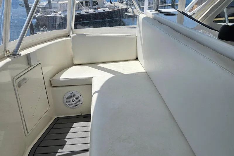 Catherine Ann Yacht Photos Pics 1998 Ocean Yachts 40 Super Sport interior with white seating and marine speaker.