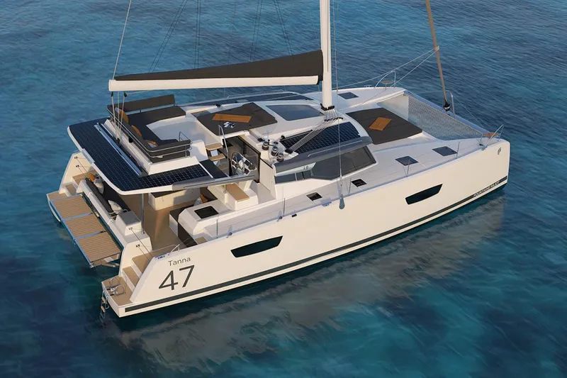 Knotty Cat Yacht Photos Pics 2024 Fountaine Pajot Tanna catamaran sailing on clear blue water.