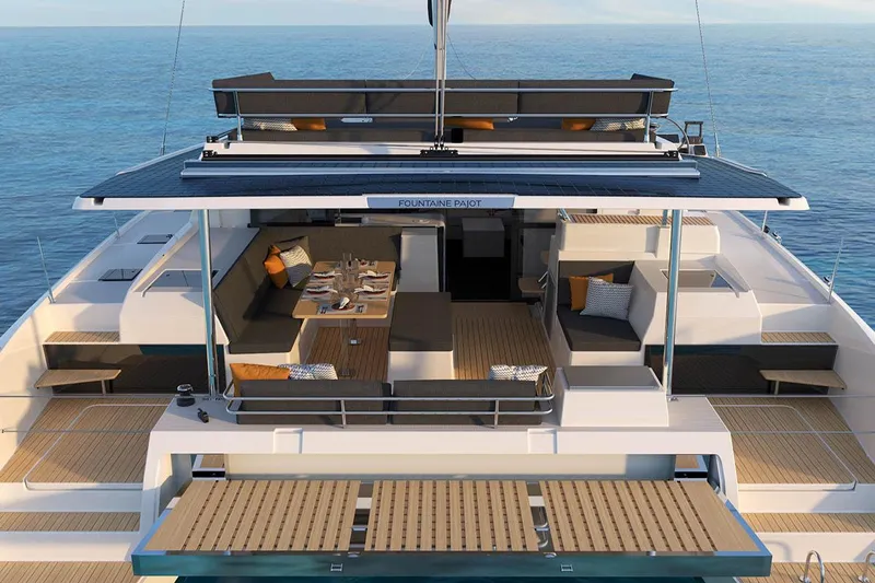 Knotty Cat Yacht Photos Pics 2024 Fountaine Pajot Tanna catamaran with spacious deck and luxurious seating.