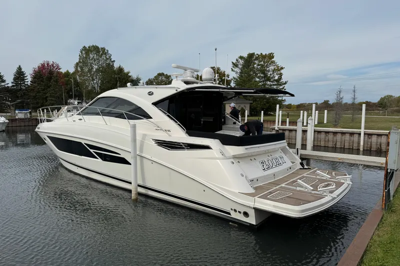 Floor It Yacht Photos Pics 2014 Sea Ray 510 Sundancer yacht docked in a serene marina setting.