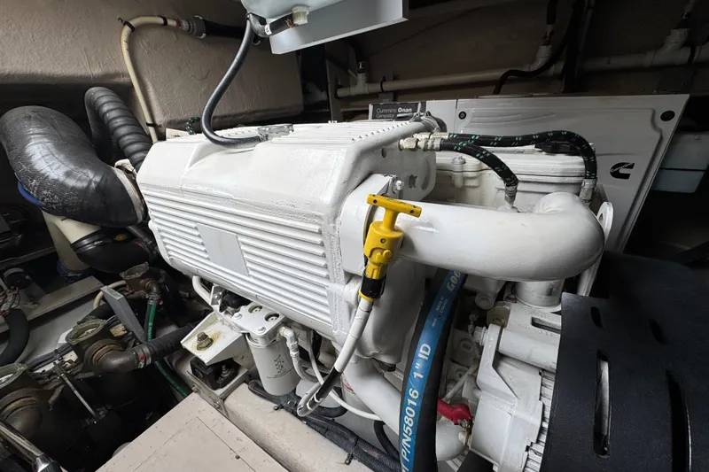 Floor It Yacht Photos Pics Engine room of 2014 Sea Ray 510 Sundancer with Cummins Onan generator.