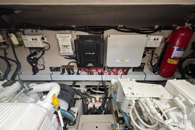 Floor It Yacht Photos Pics Engine room of 2014 Sea Ray 510 Sundancer with control panels and fire extinguisher.