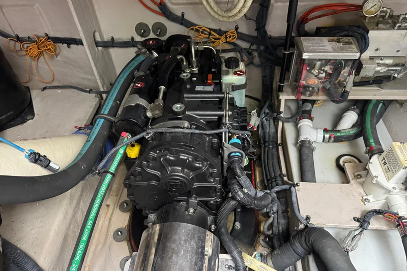 Floor It Yacht Photos Pics Engine compartment of a 2014 Sea Ray 510 Sundancer, showcasing detailed mechanical components.
