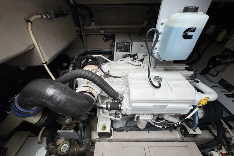 Floor It Yacht Photos Pics Engine compartment of 2014 Sea Ray 510 Sundancer with Cummins generator and components.