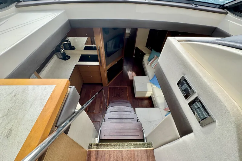 Floor It Yacht Photos Pics Luxurious interior of 2014 Sea Ray 510 Sundancer yacht with modern amenities and elegant design.