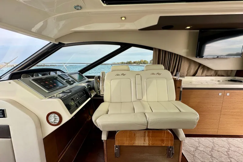 Floor It Yacht Photos Pics 2014 Sea Ray 510 Sundancer yacht interior with helm, leather seating, and modern dashboard.