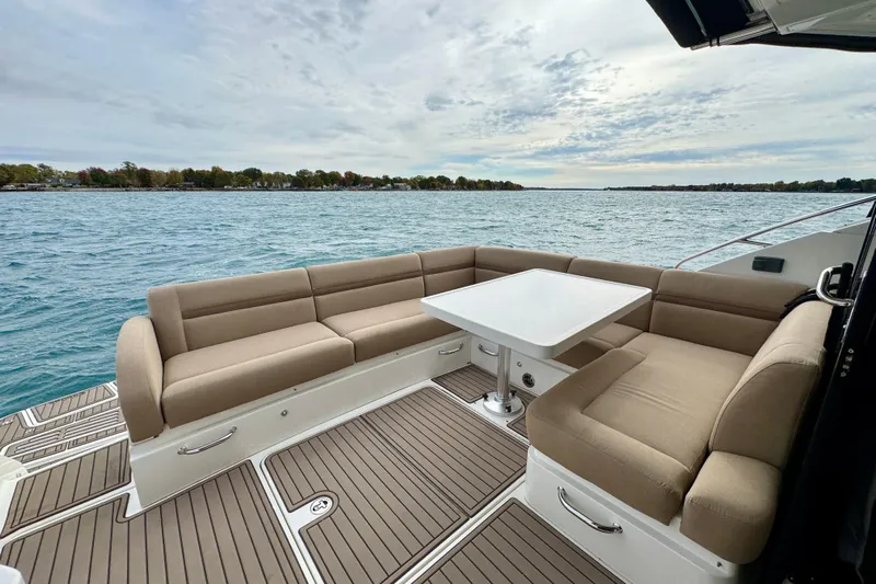 Floor It Yacht Photos Pics Luxurious 2014 Sea Ray 510 Sundancer yacht with spacious outdoor seating and scenic water view.