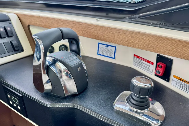 Floor It Yacht Photos Pics Control panel of 2014 Sea Ray 510 Sundancer yacht with throttle and joystick.